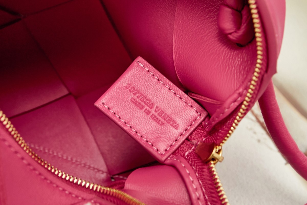 bo*te*ga Ve*ne*ta mini cassette camera bag in cranberry lambskin