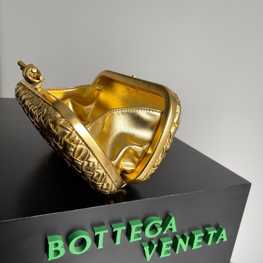 bo*te*ga Ve*ne*ta knot minaudiere clutch in gold intreccio laminated leather