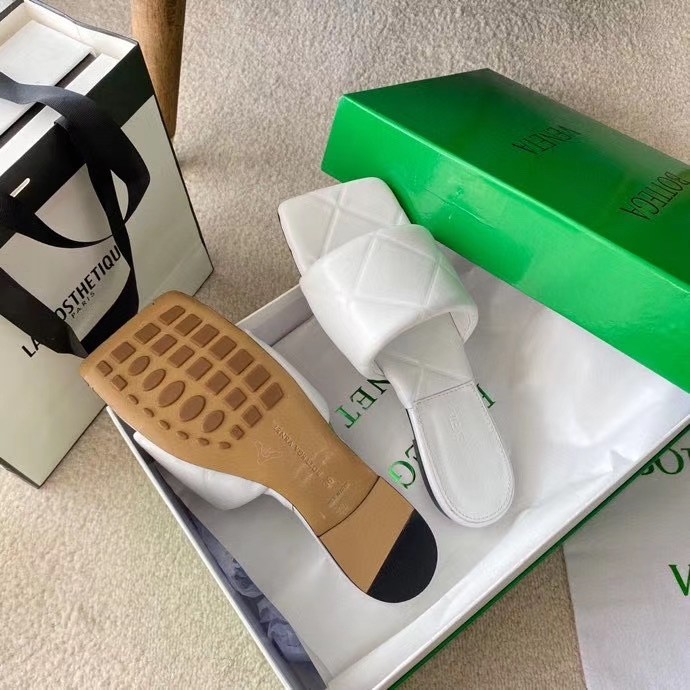 bo*te*ga Ve*ne*ta rubber lido slides in white lambskin
