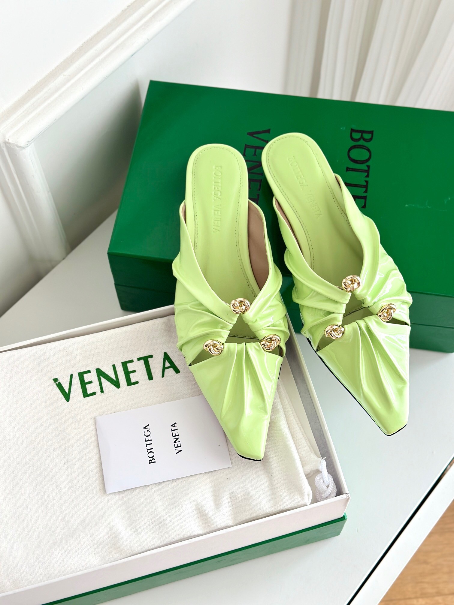 bo*te*ga Ve*ne*ta bunnie flat mules in fennel patent leather