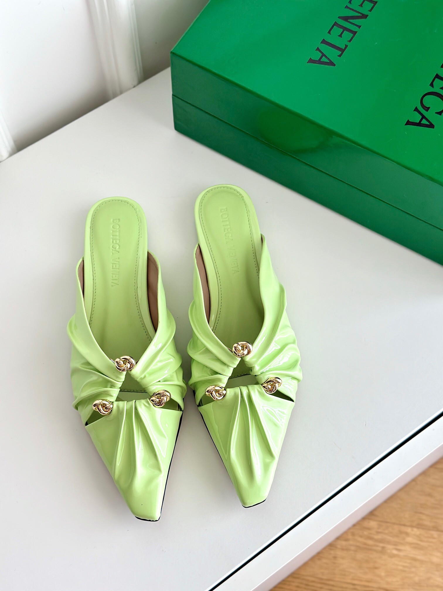 bo*te*ga Ve*ne*ta bunnie flat mules in fennel patent leather
