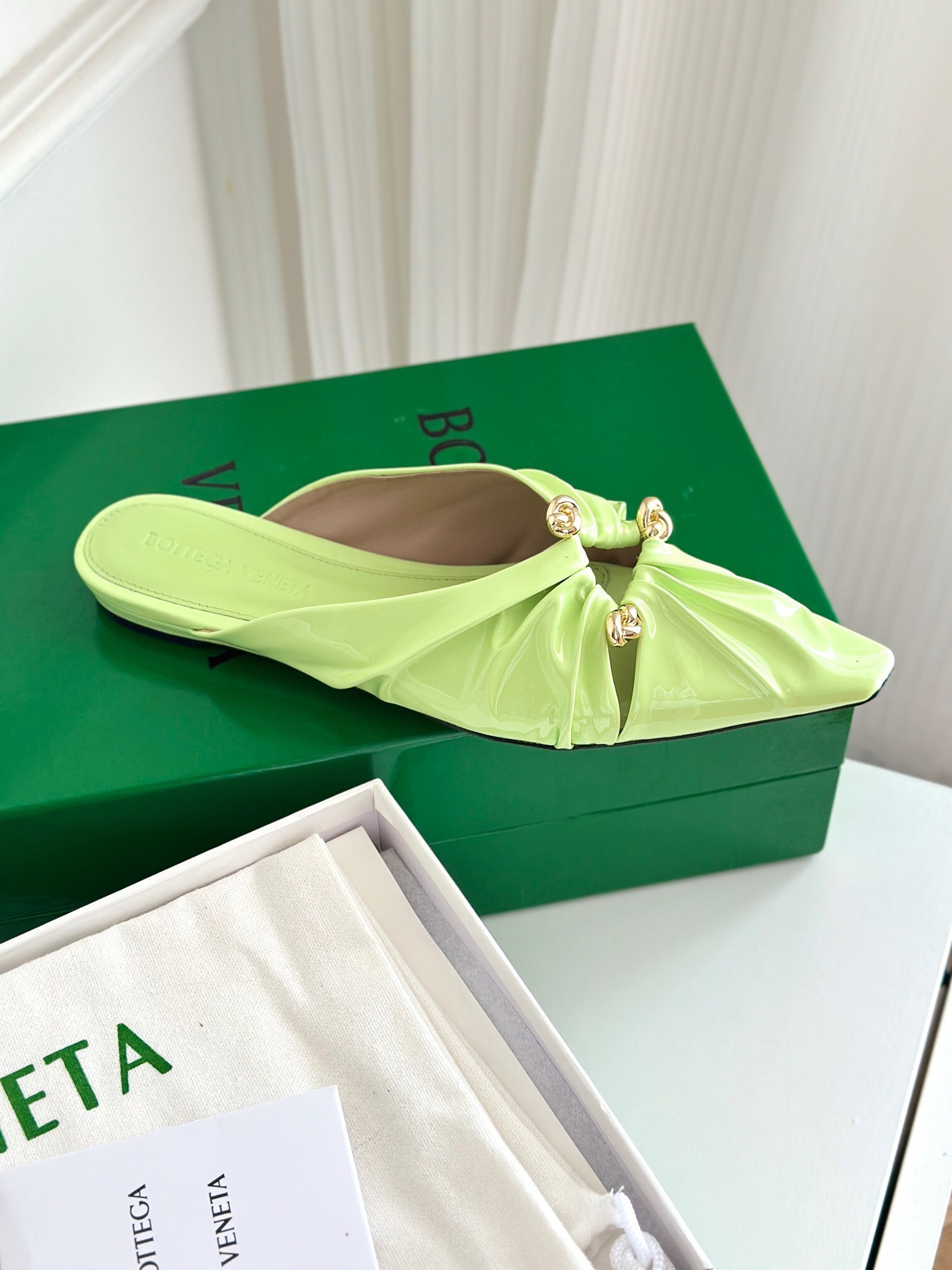 bo*te*ga Ve*ne*ta bunnie flat mules in fennel patent leather