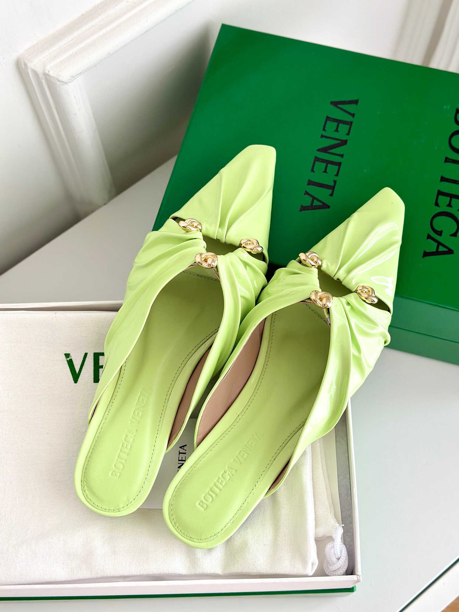 bo*te*ga Ve*ne*ta bunnie flat mules in fennel patent leather