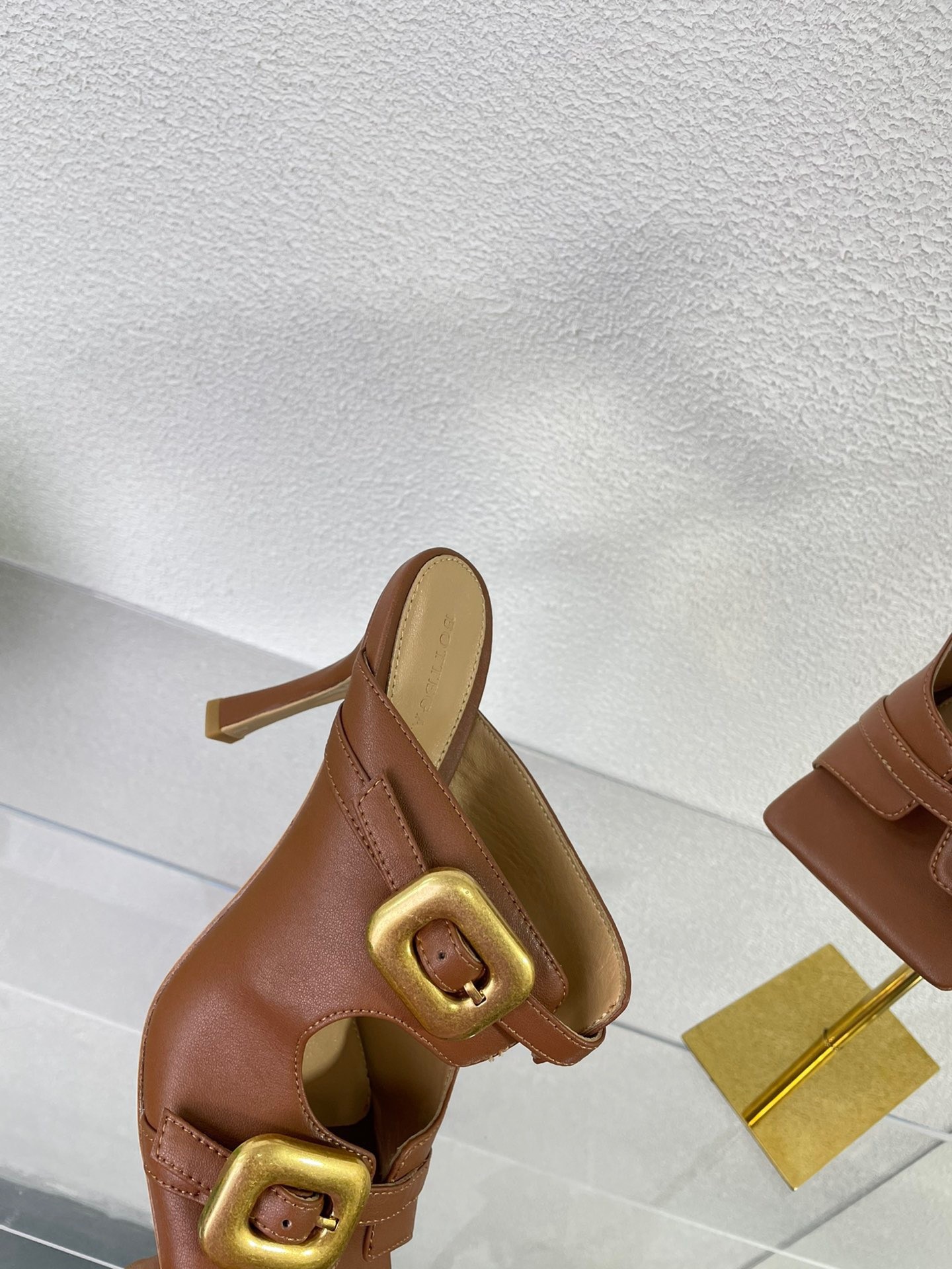bo*te*ga Ve*ne*ta stretch buckle mules in caramel calfskin
