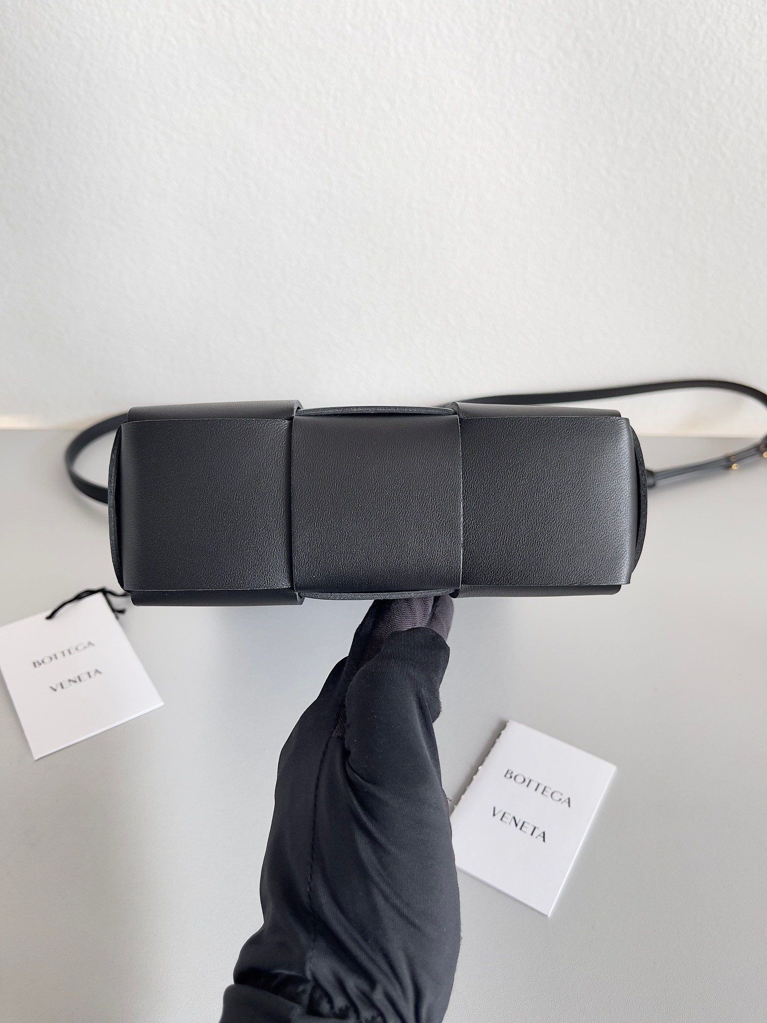 bo*te*ga Ve*ne*ta mini cassette tote bag in black lambskin
