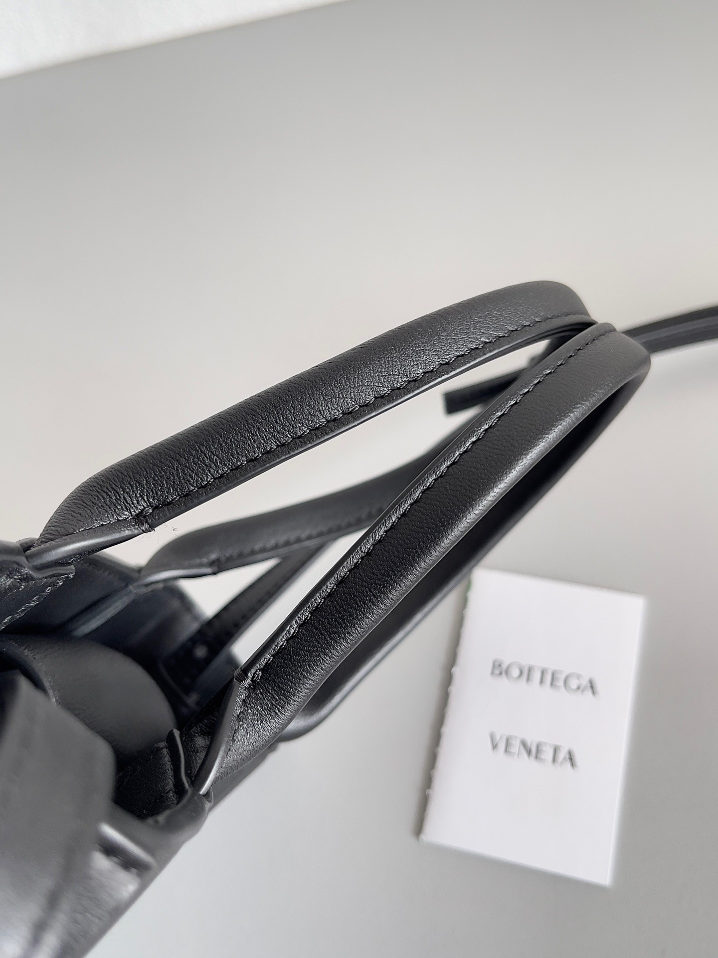 bo*te*ga Ve*ne*ta mini cassette tote bag in black lambskin