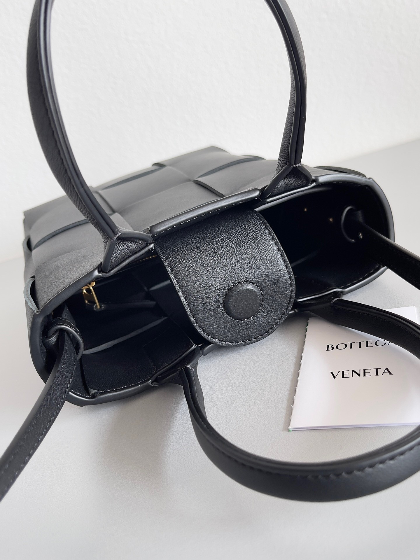 bo*te*ga Ve*ne*ta mini cassette tote bag in black lambskin