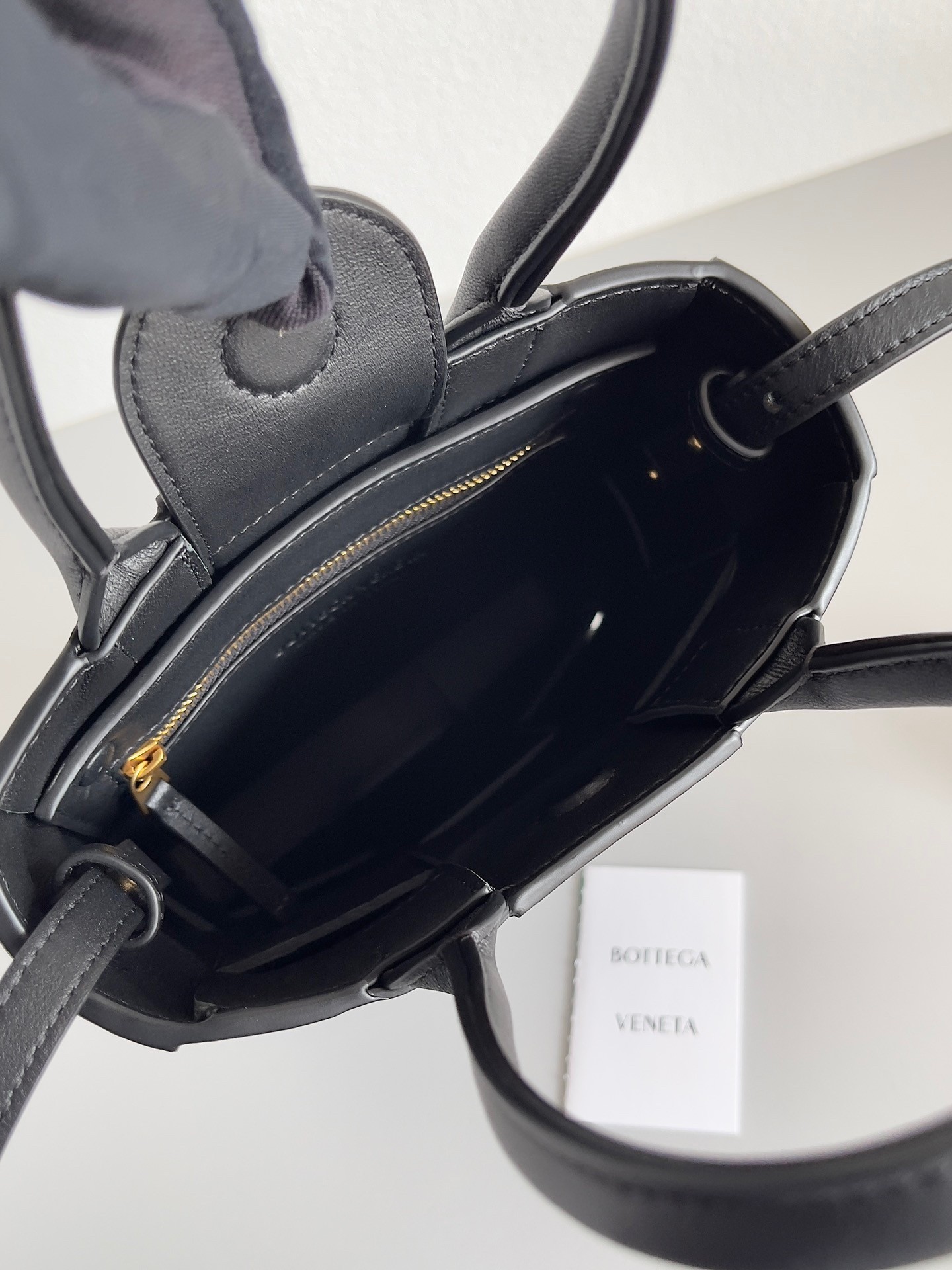 bo*te*ga Ve*ne*ta mini cassette tote bag in black lambskin