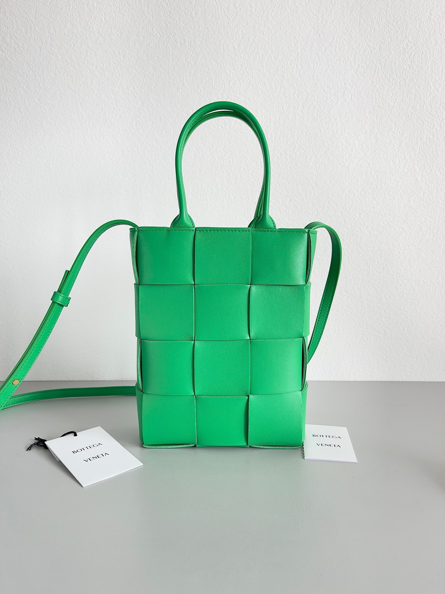 bo*te*ga Ve*ne*ta mini cassette tote bag in parakeet lambskin
