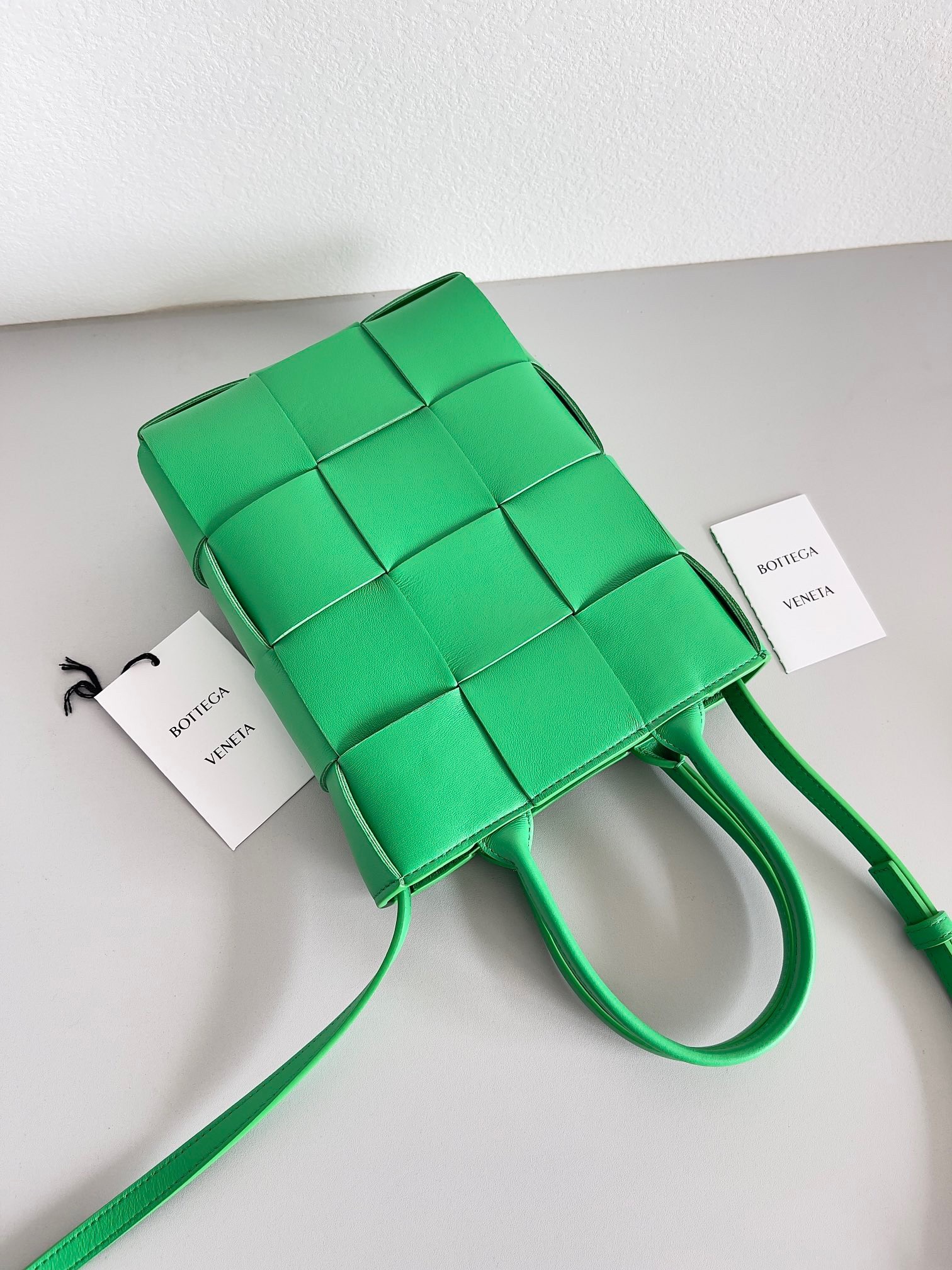 bo*te*ga Ve*ne*ta mini cassette tote bag in parakeet lambskin