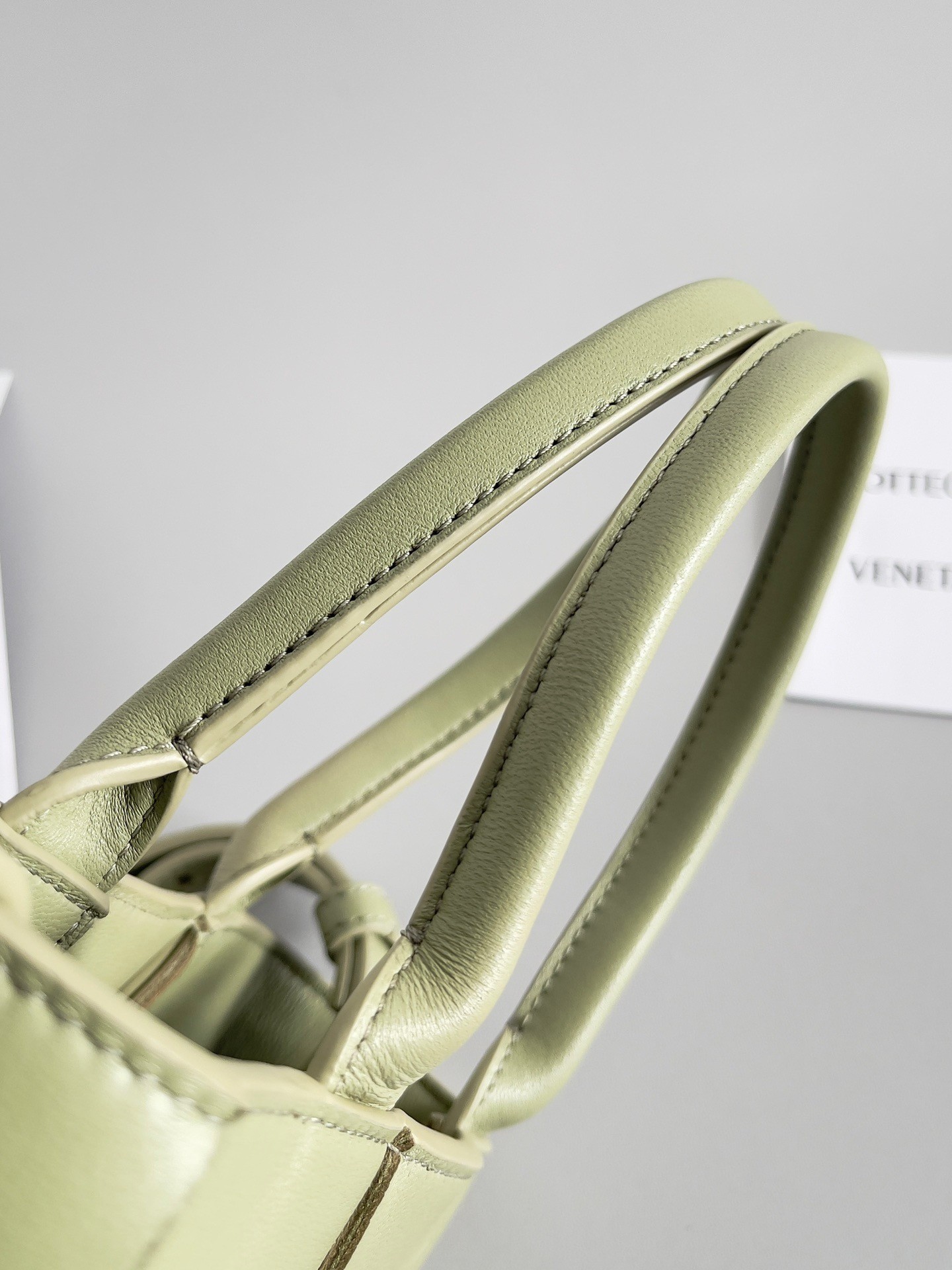 bo*te*ga Ve*ne*ta mini cassette tote bag in travertine lambskin