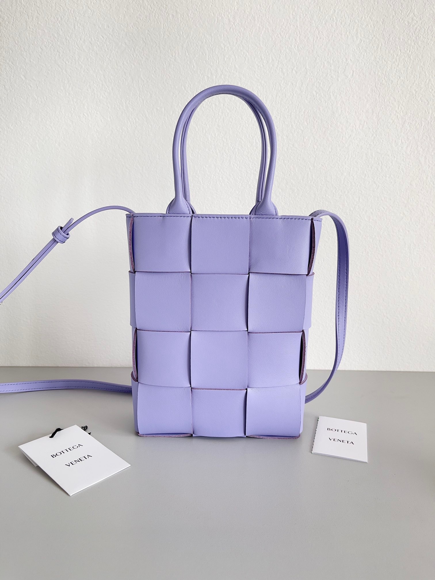 bo*te*ga Ve*ne*ta mini cassette tote bag in wisteria lambskin