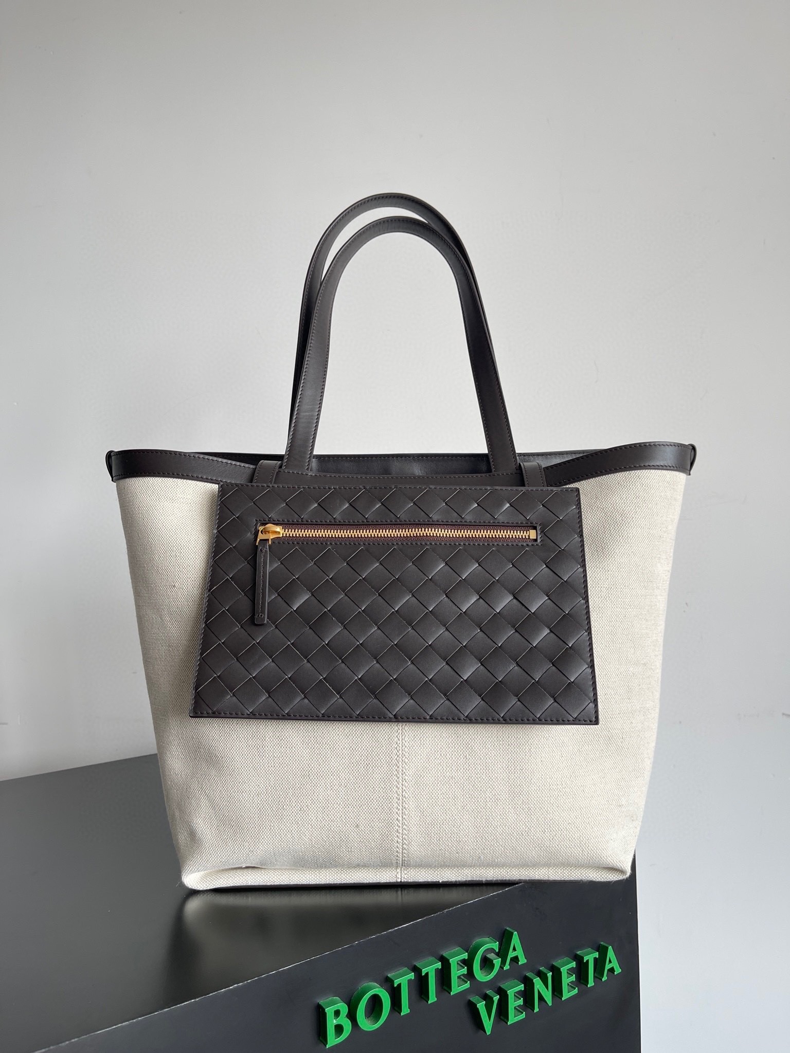 bo*te*ga Ve*ne*ta medium flip flap bag in canvas with fondant leather