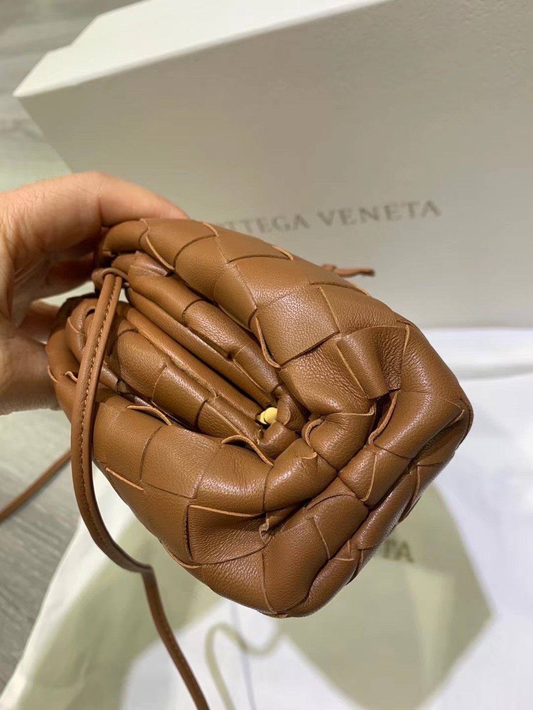 bo*te*ga Ve*ne*ta mini pouch in caramel intrecciato lambskin
