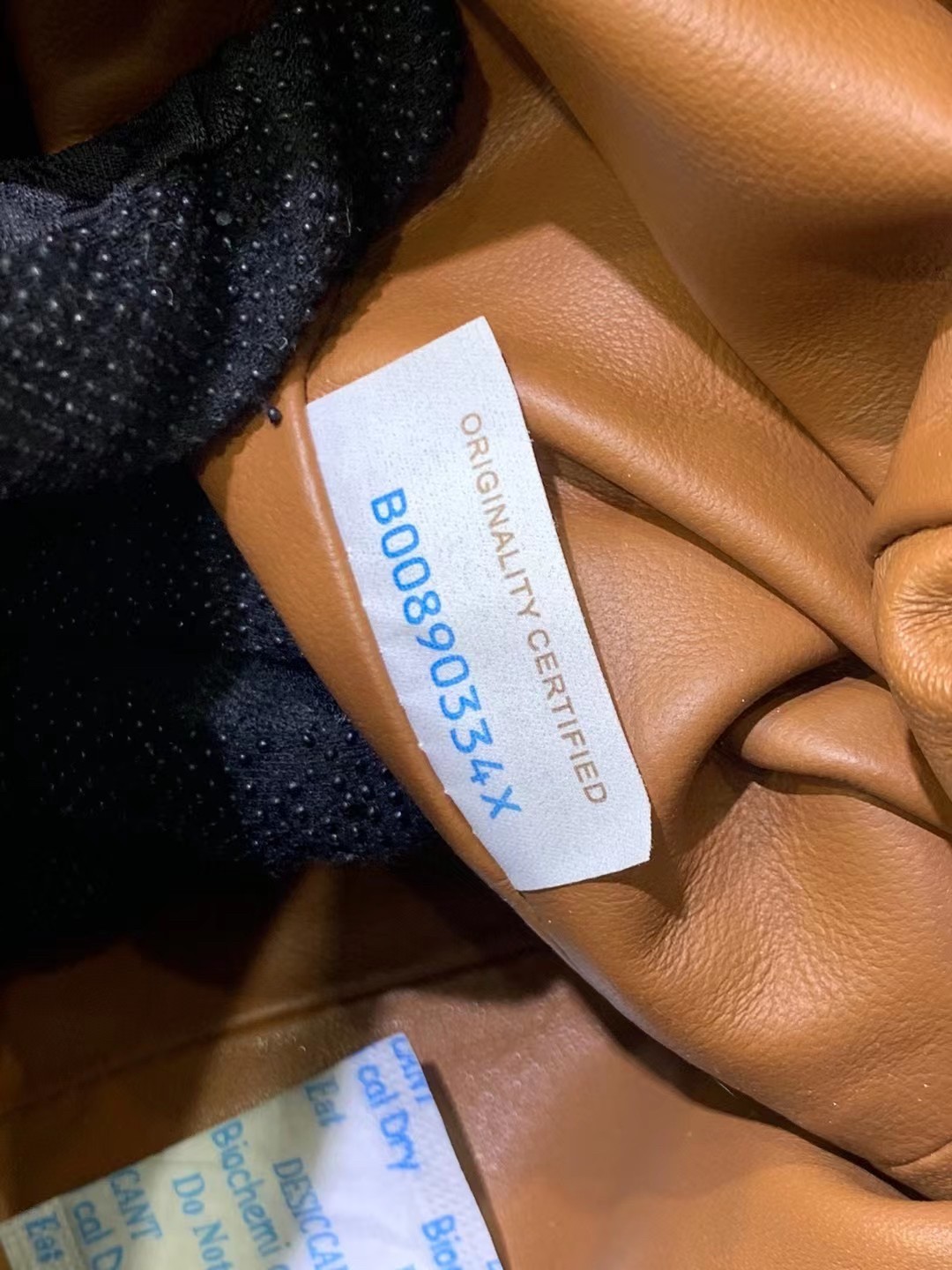 bo*te*ga Ve*ne*ta mini pouch in caramel intrecciato lambskin