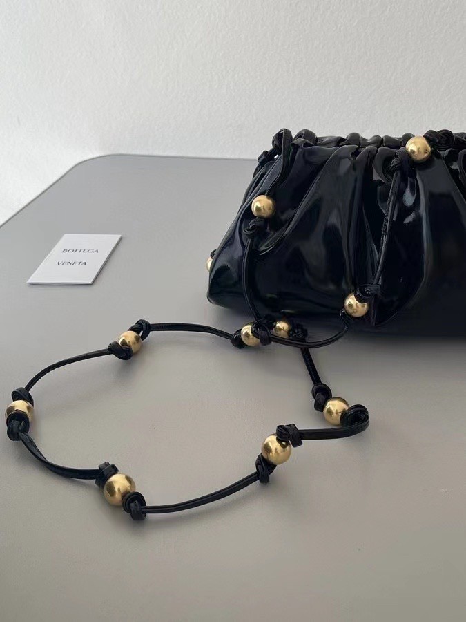 bo*te*ga Ve*ne*ta mini pouch in black patent leather
