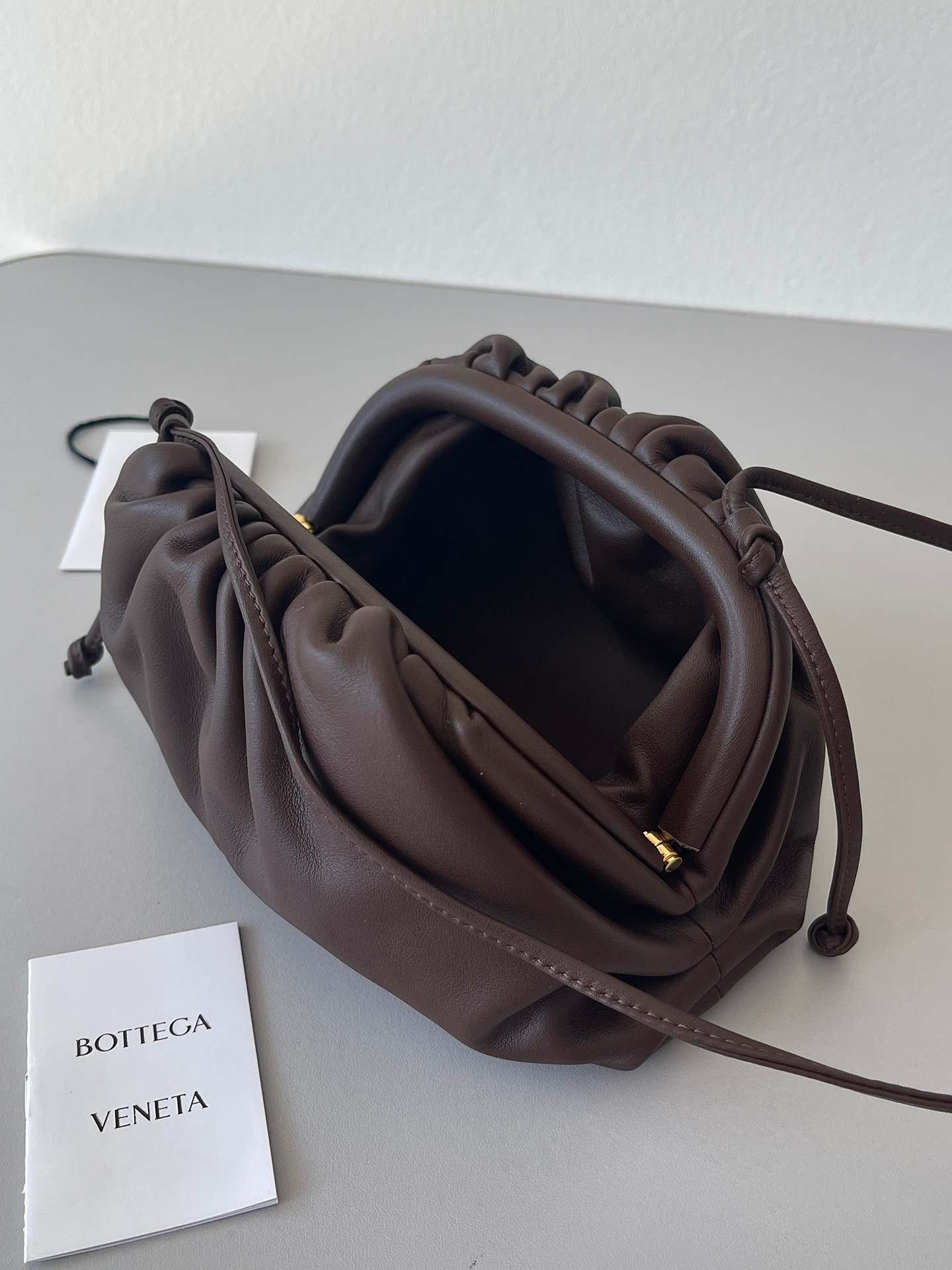 bo*te*ga Ve*ne*ta mini pouch bag in fondant calfskin