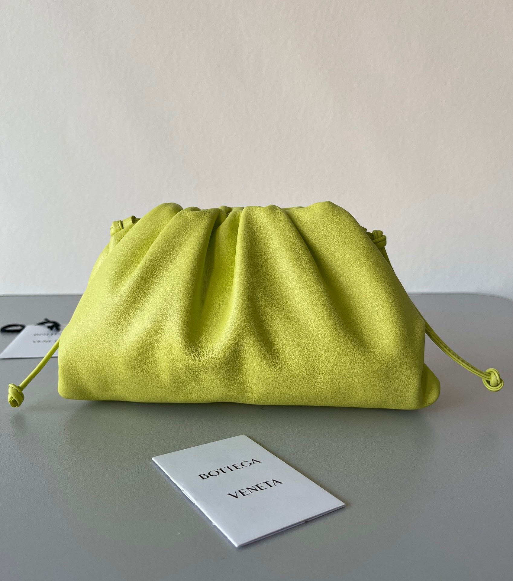 bo*te*ga Ve*ne*ta mini pouch bag in kiwi calfskin