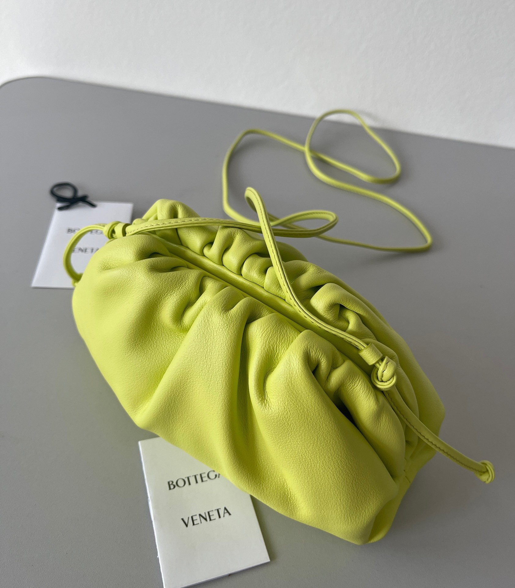 bo*te*ga Ve*ne*ta mini pouch bag in kiwi calfskin