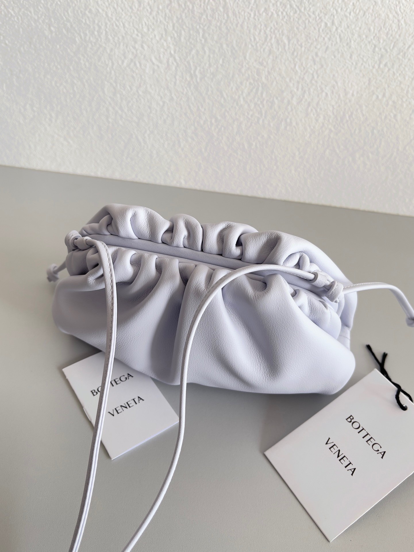 bo*te*ga Ve*ne*ta mini pouch bag in mirth washed calfskin