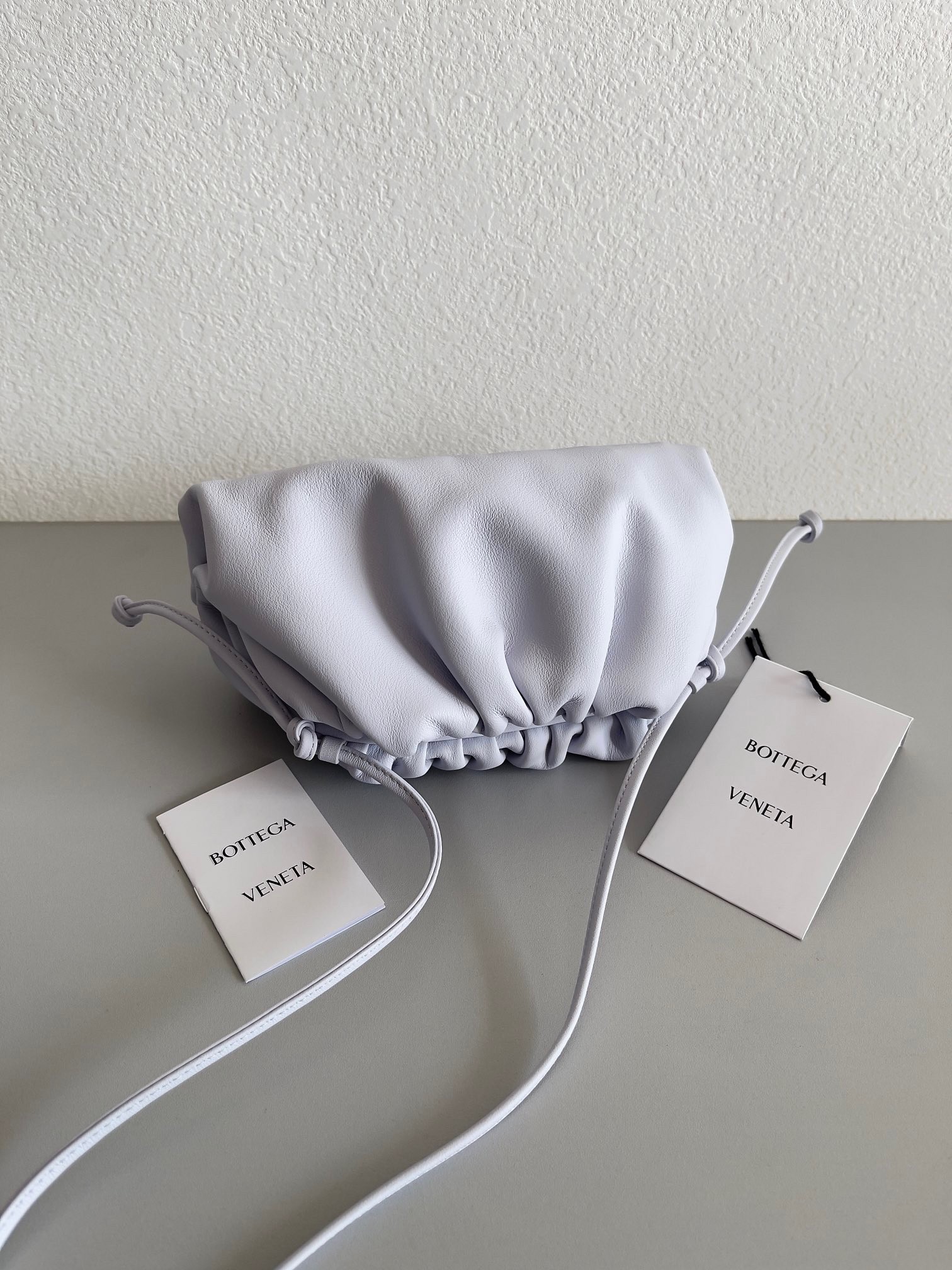 bo*te*ga Ve*ne*ta mini pouch bag in mirth washed calfskin