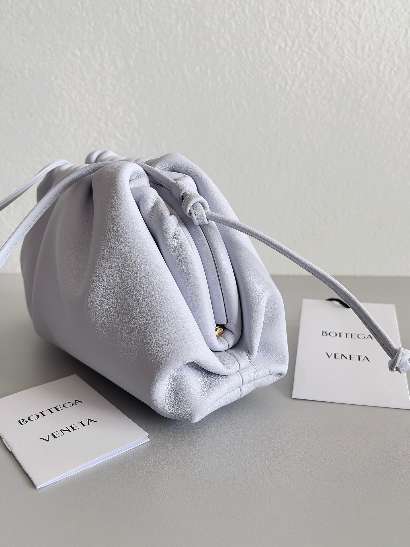 bo*te*ga Ve*ne*ta mini pouch bag in mirth washed calfskin