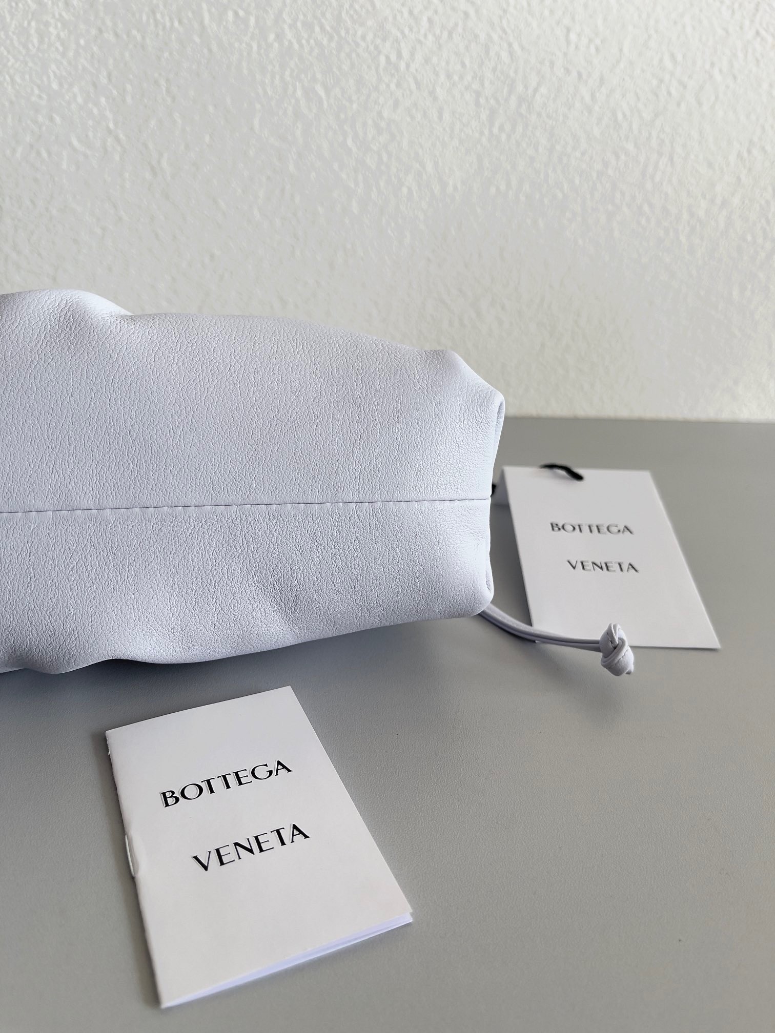 bo*te*ga Ve*ne*ta mini pouch bag in mirth washed calfskin