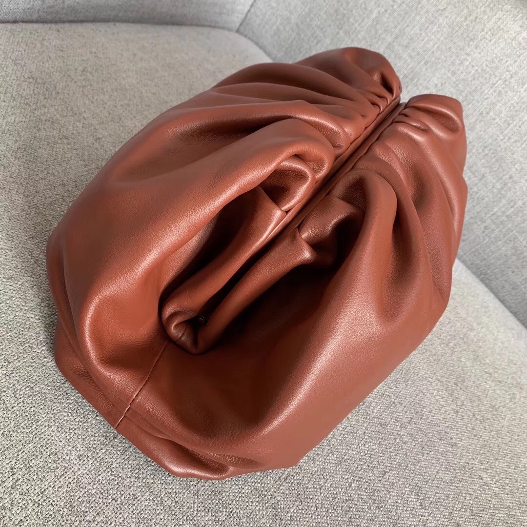 bo*te*ga Ve*ne*ta the pouch clutch in rust calfskin