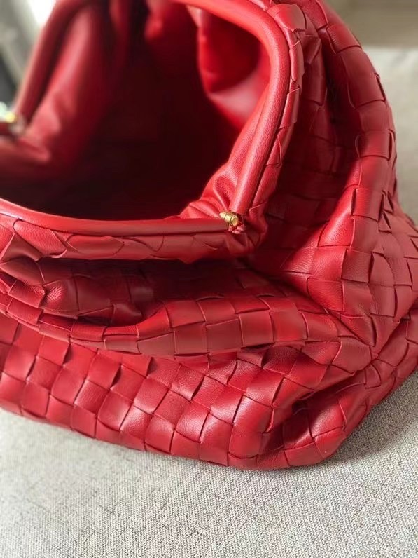 bo*te*ga Ve*ne*ta large pouch clutch in red intrecciato lambskin