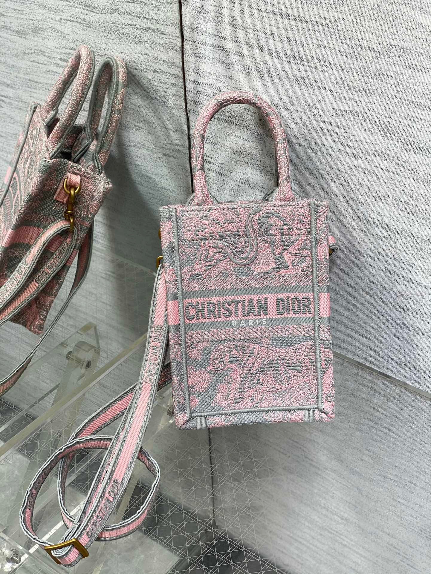 D*or mini D*oriviera book tote phone bag in pink toile de jouy reverse embroidery