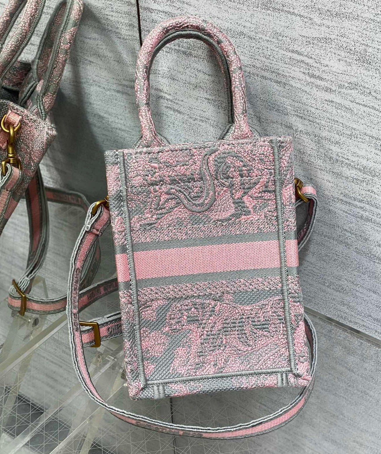 D*or mini D*oriviera book tote phone bag in pink toile de jouy reverse embroidery