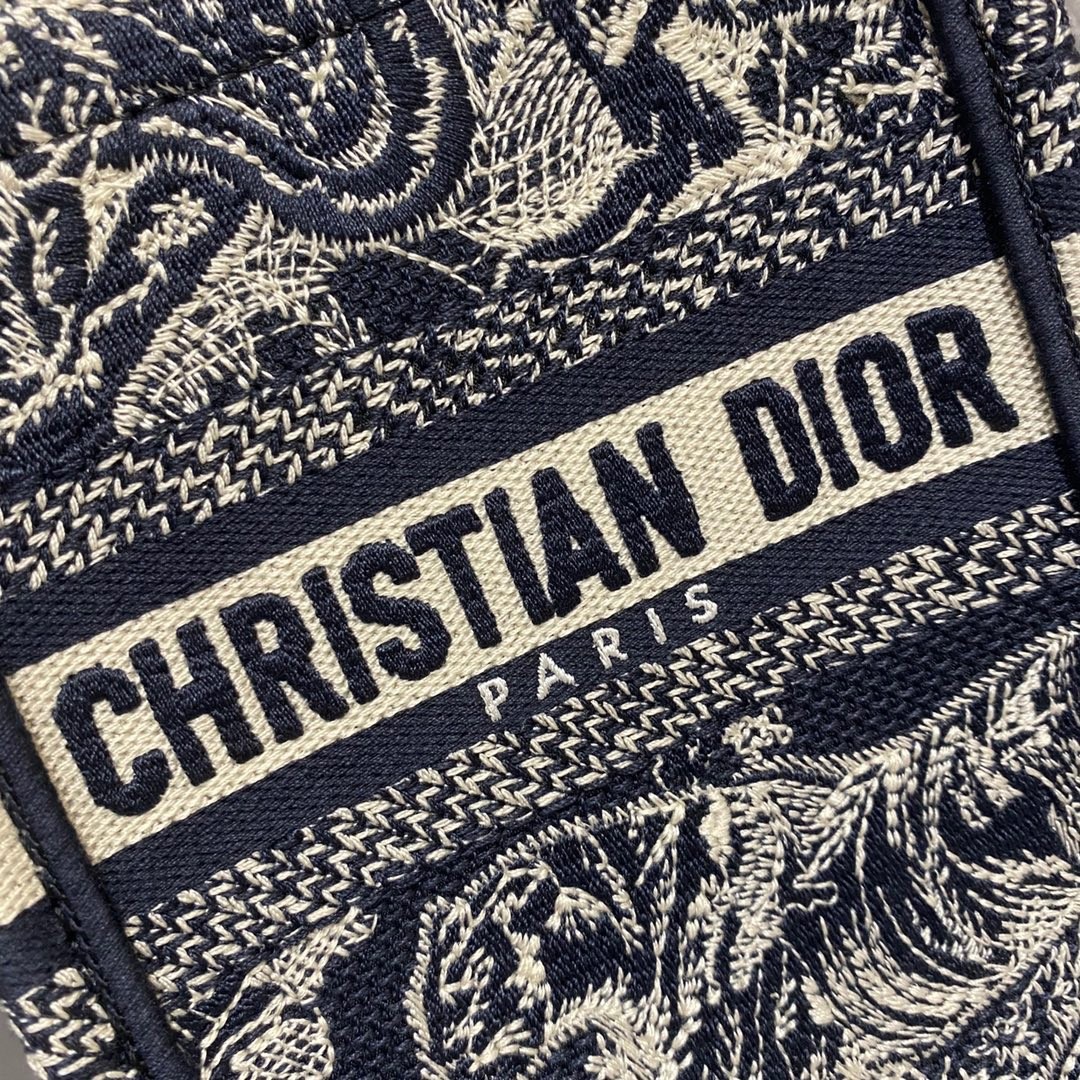 D*or mini book tote phone bag in blue toile de jouy reverse embroidery