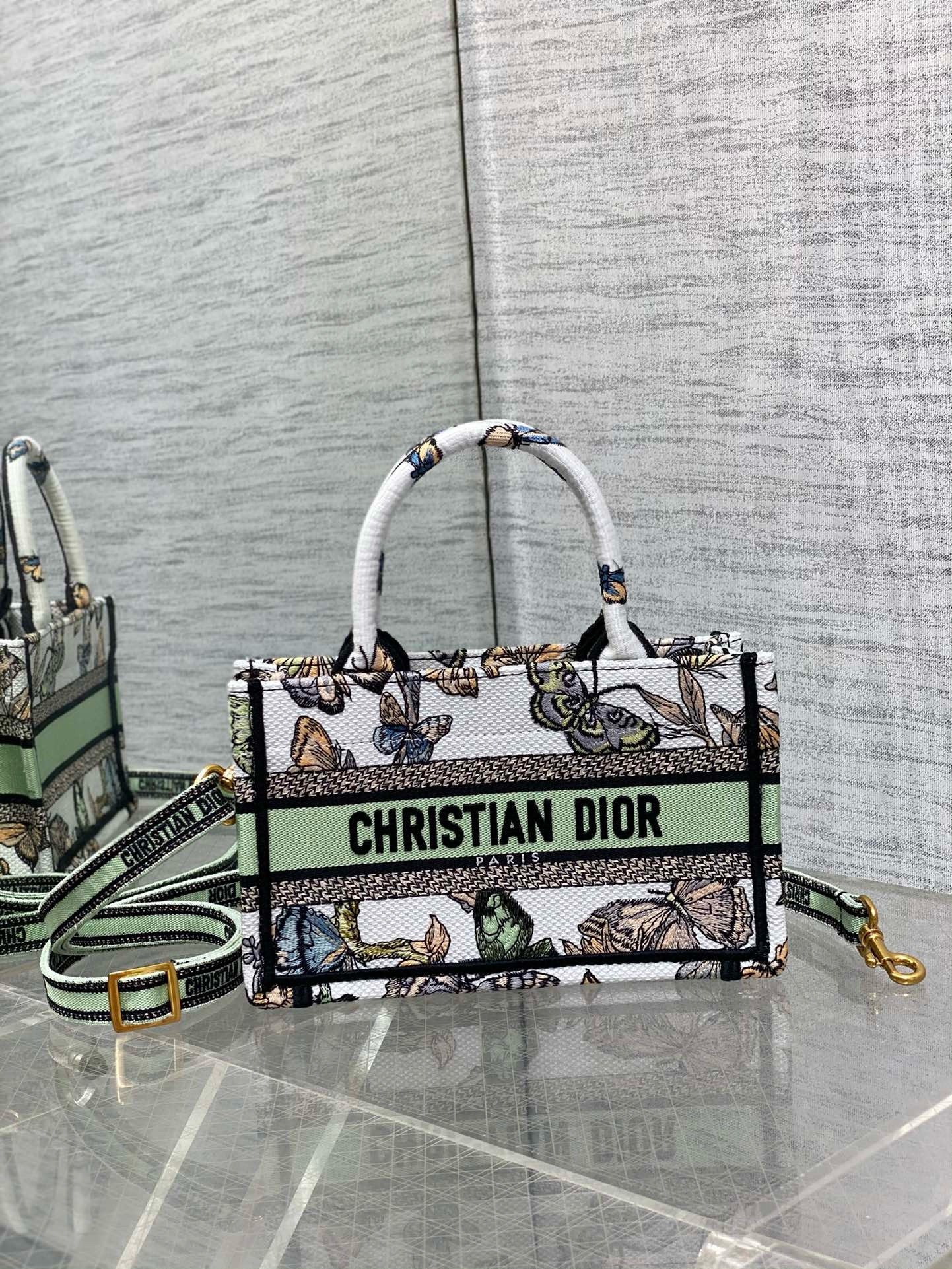D*or mini book tote with strap in white toile de jouy mexico embroidery