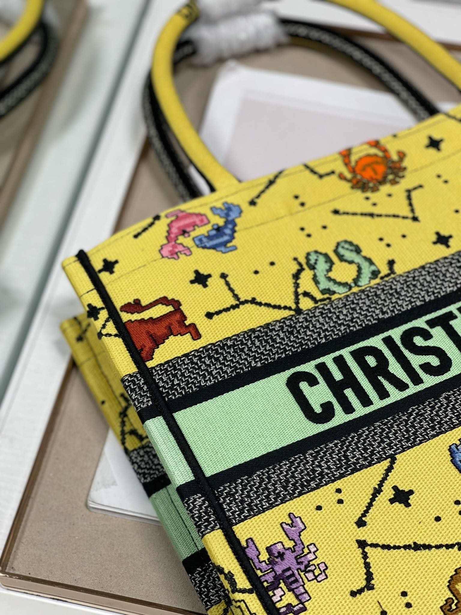 D*or small book tote bag in yellow multicolor pixel zodiac embroidery