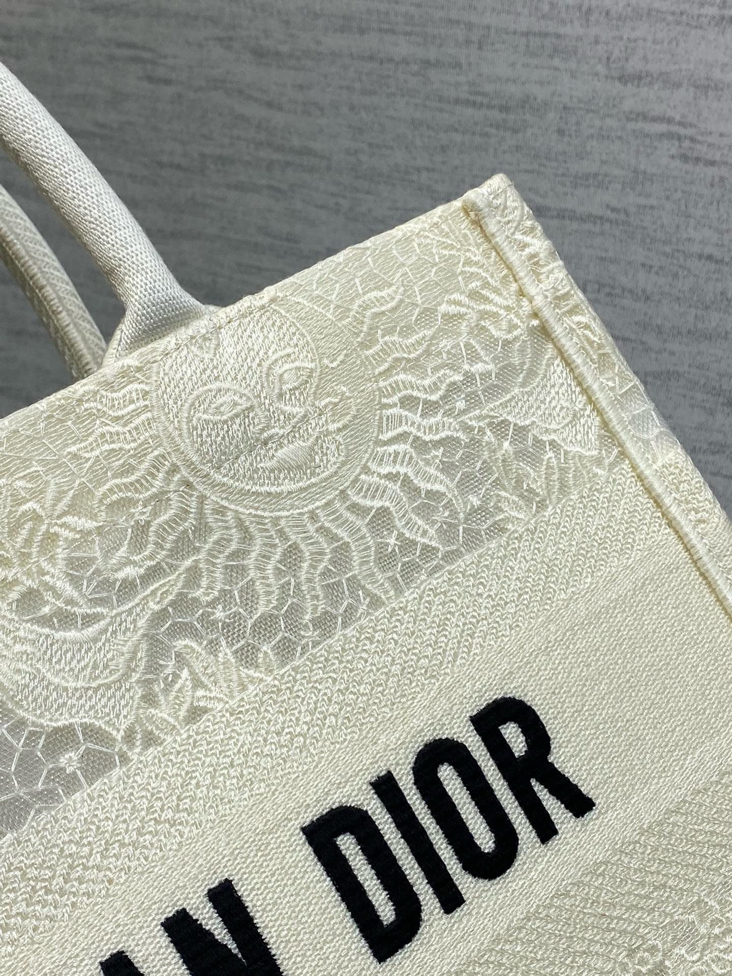 D*or medium book tote bag in white toile de jouy soleil macramé embroidery