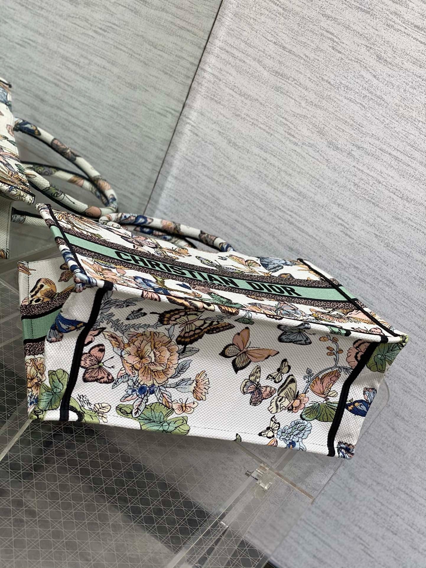 D*or medium book tote bag in white toile de jouy mexico embroidery