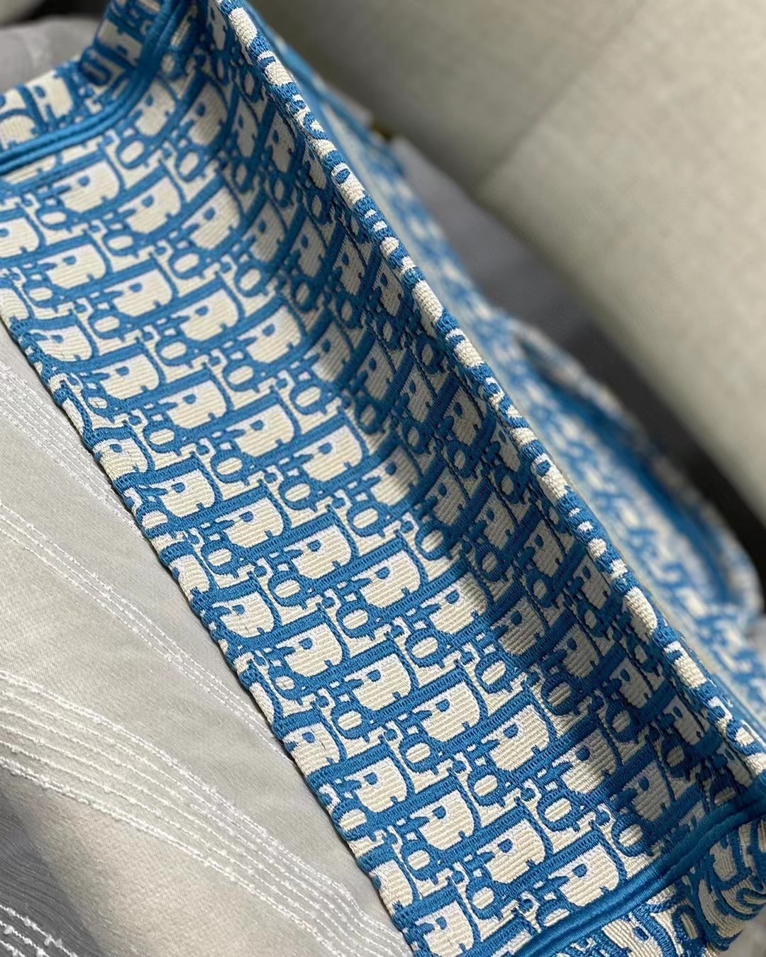D*or small book tote in cornflower blue D*or oblique embroidery
