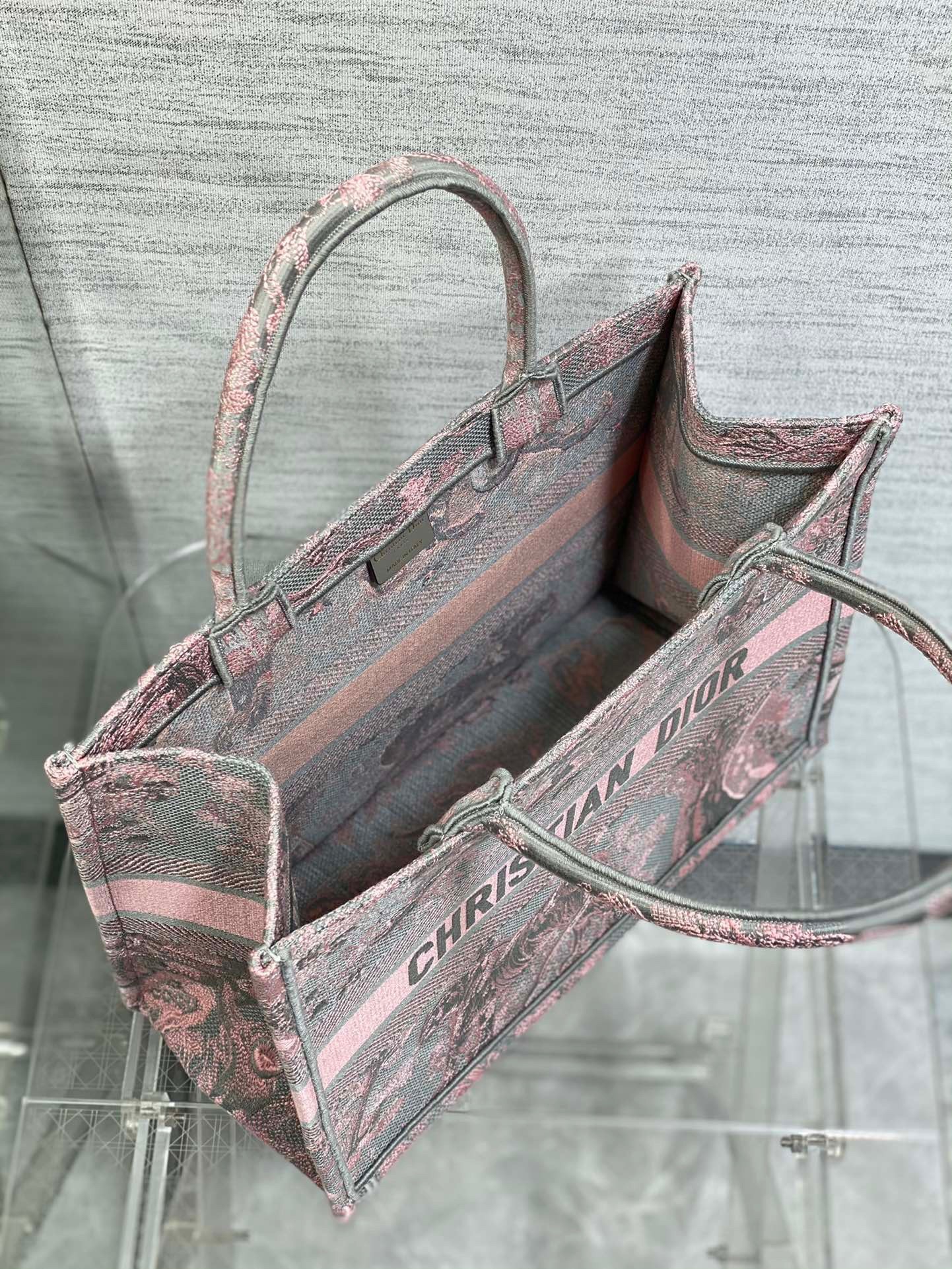 D*or medium book tote bag in grey and pink toile de jouy reverse embroidery