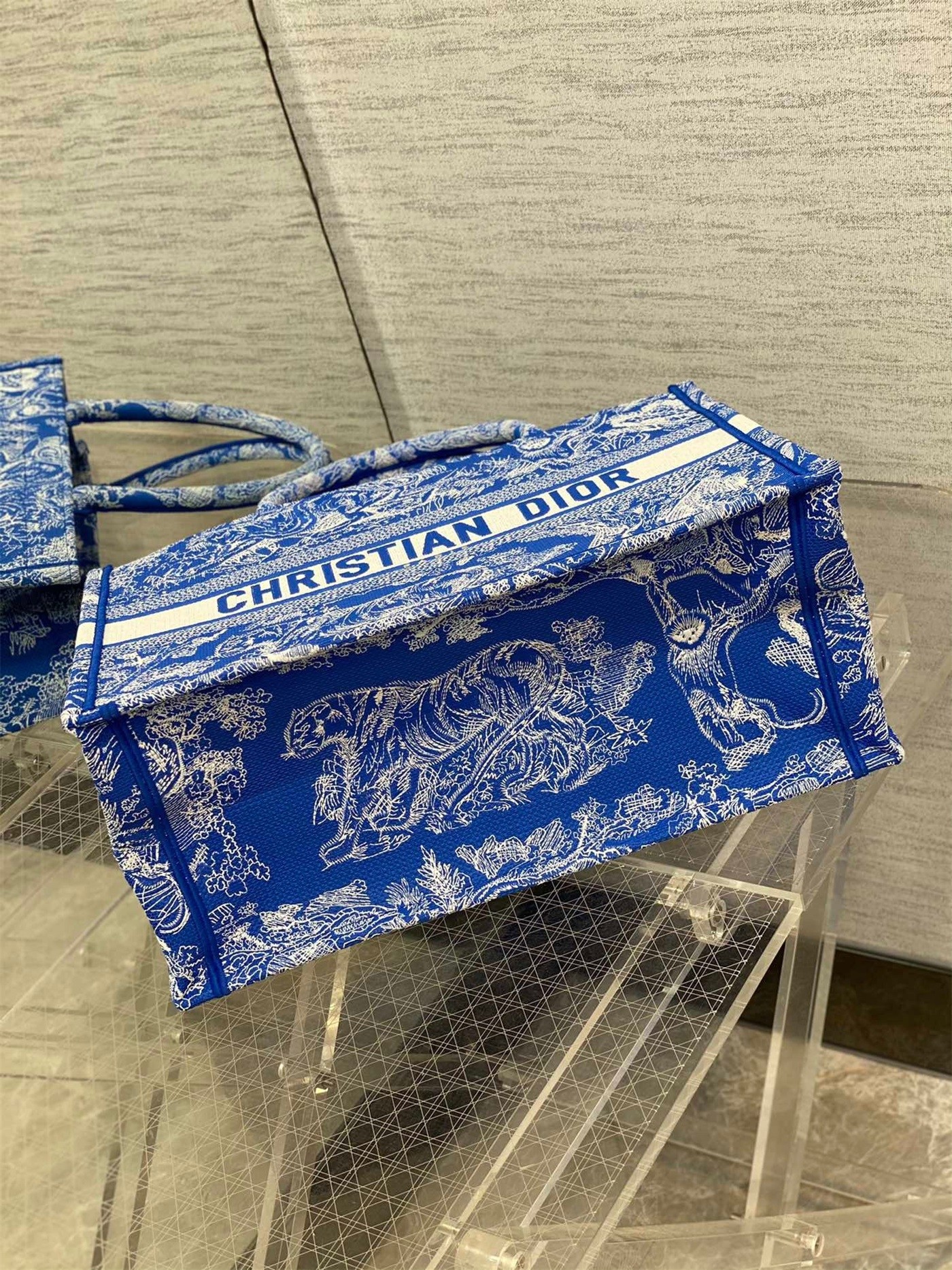 D*or medium book tote bag in fluorescent blue toile de jouy reverse embroidery