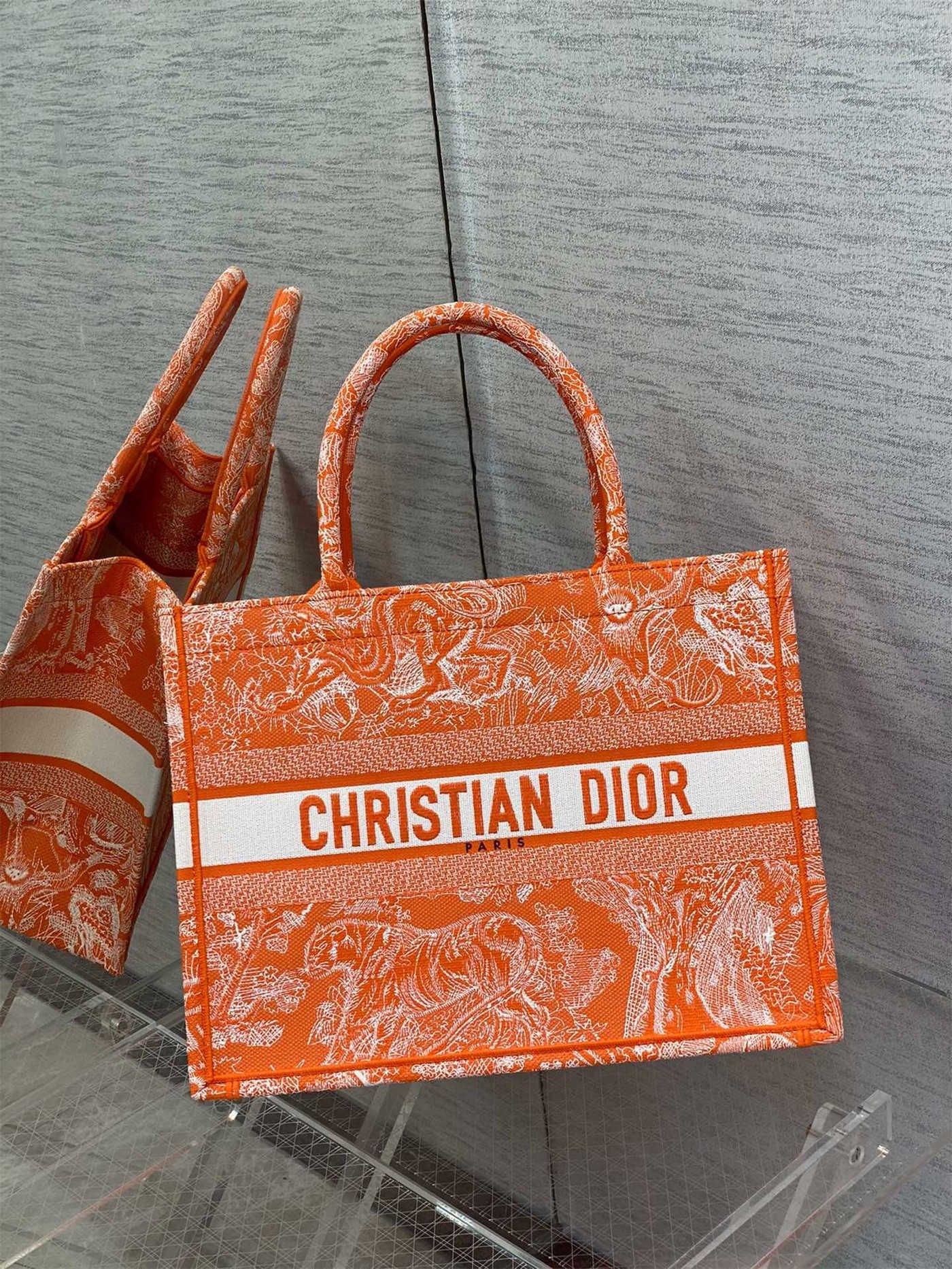 D*or medium book tote bag in fluorescent orange toile de jouy reverse embroidery