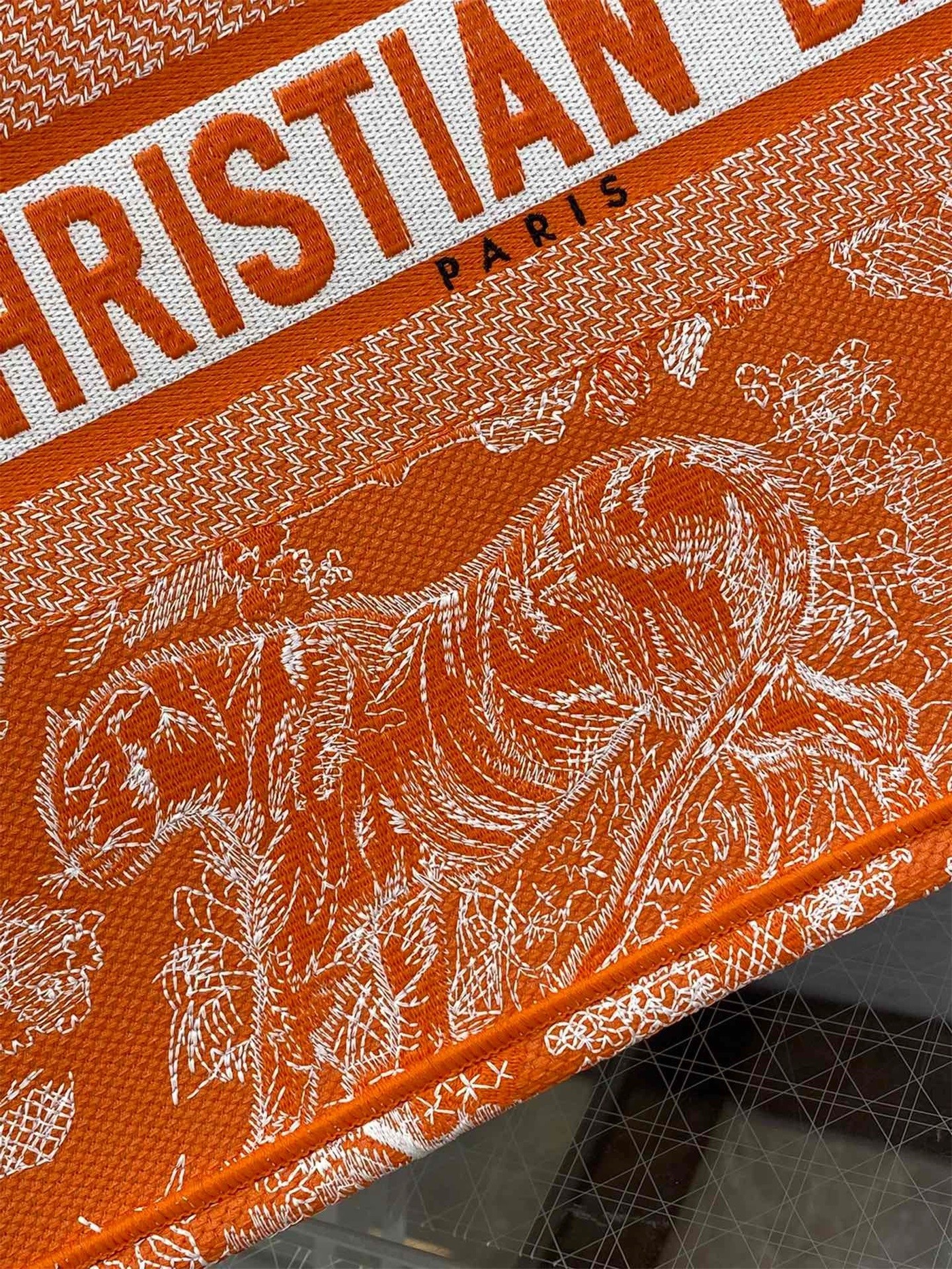 D*or medium book tote bag in fluorescent orange toile de jouy reverse embroidery