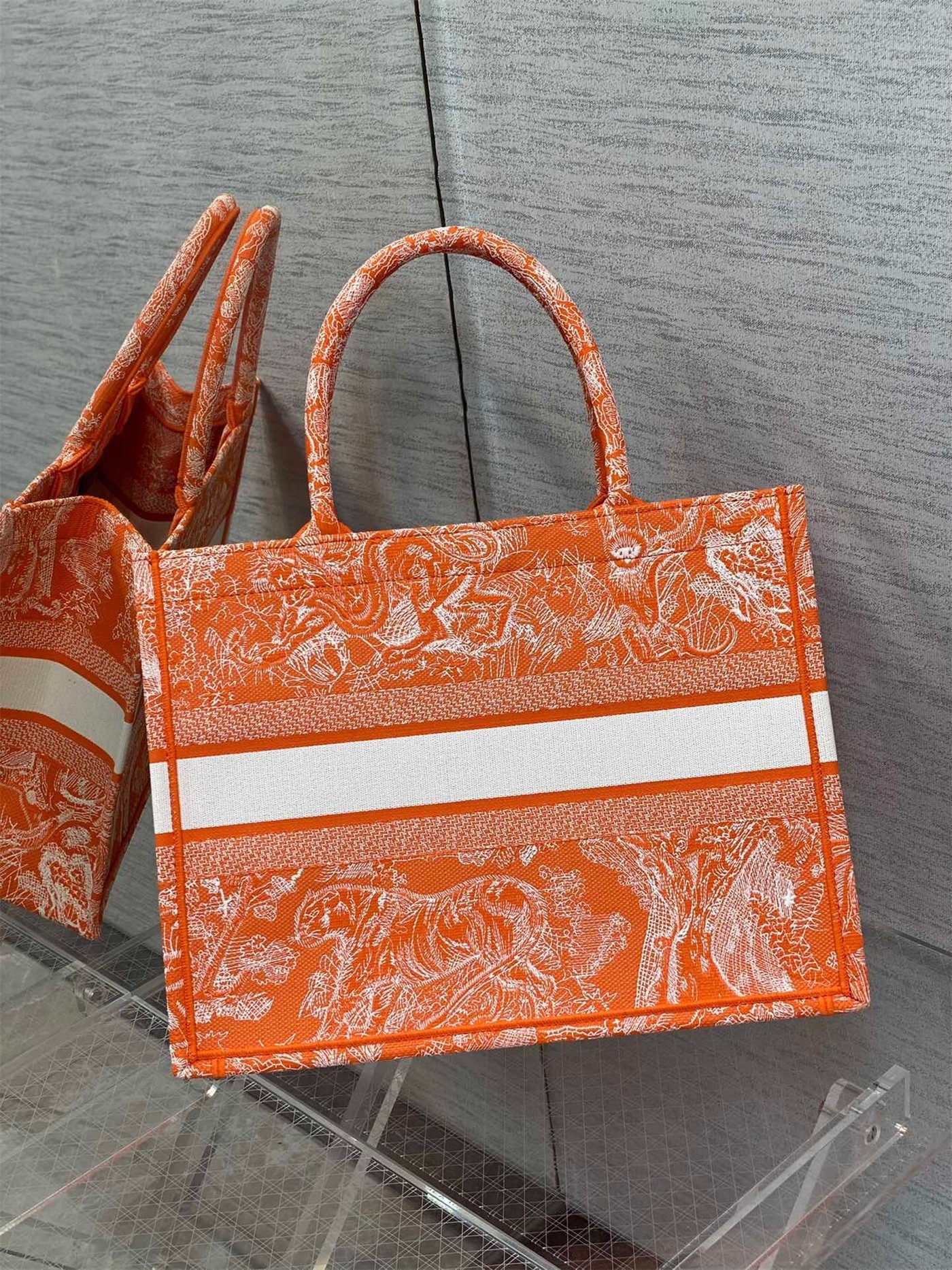 D*or medium book tote bag in fluorescent orange toile de jouy reverse embroidery