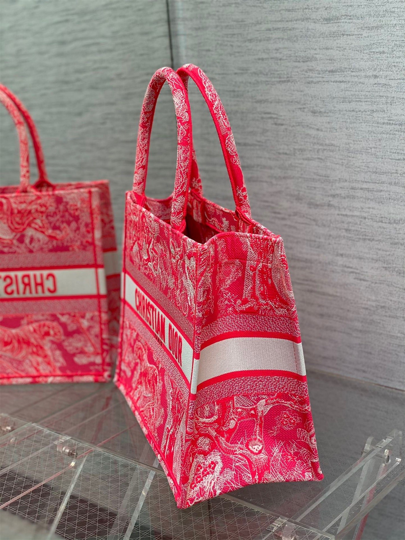 D*or medium book tote bag in fluorescent pink toile de jouy reverse embroidery