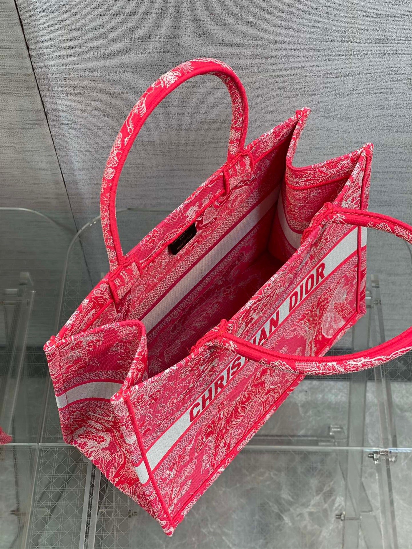 D*or medium book tote bag in fluorescent pink toile de jouy reverse embroidery