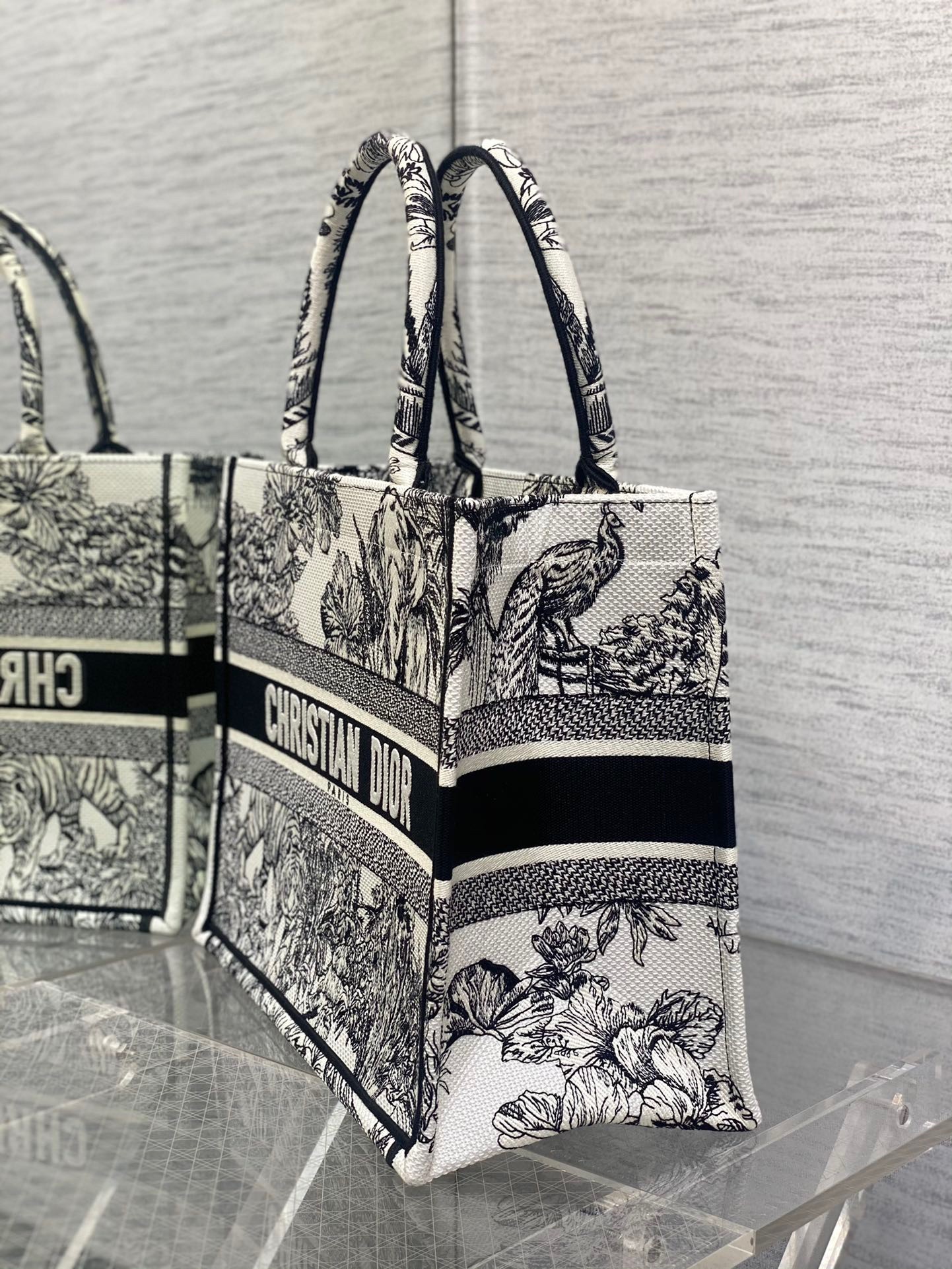 D*or medium book tote bag in white toile de jouy voyage embroidery