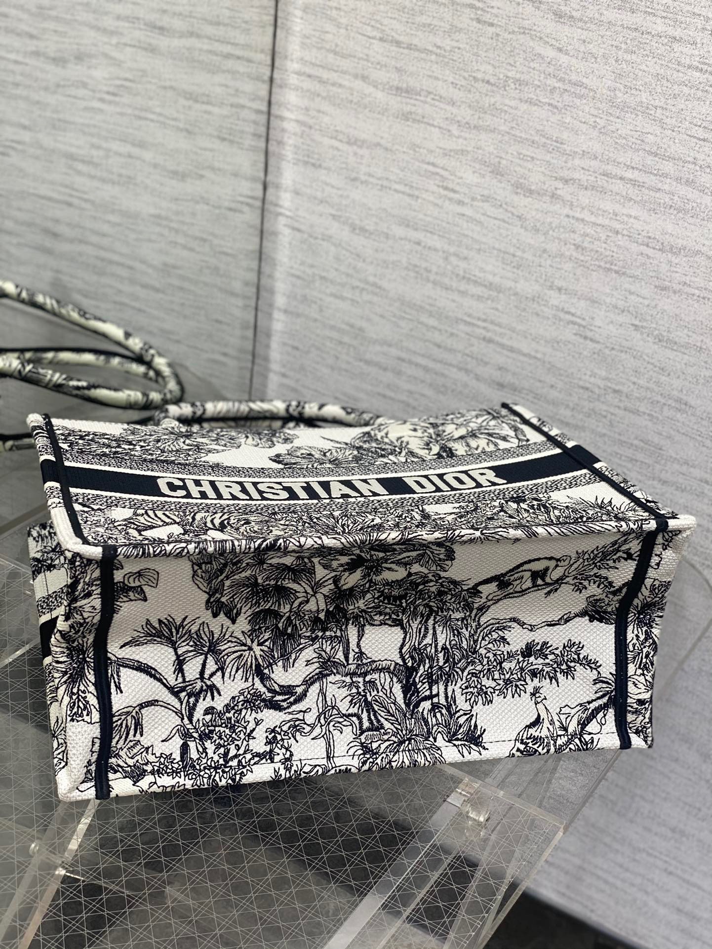 D*or medium book tote bag in white toile de jouy voyage embroidery