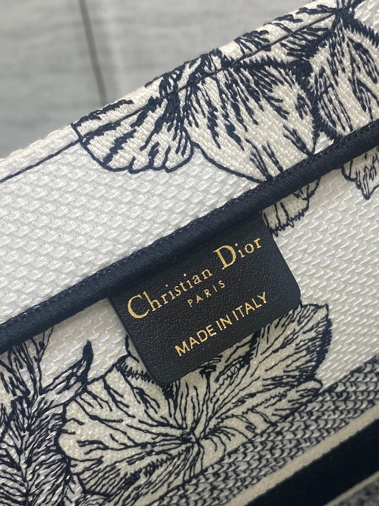 D*or medium book tote bag in white toile de jouy voyage embroidery