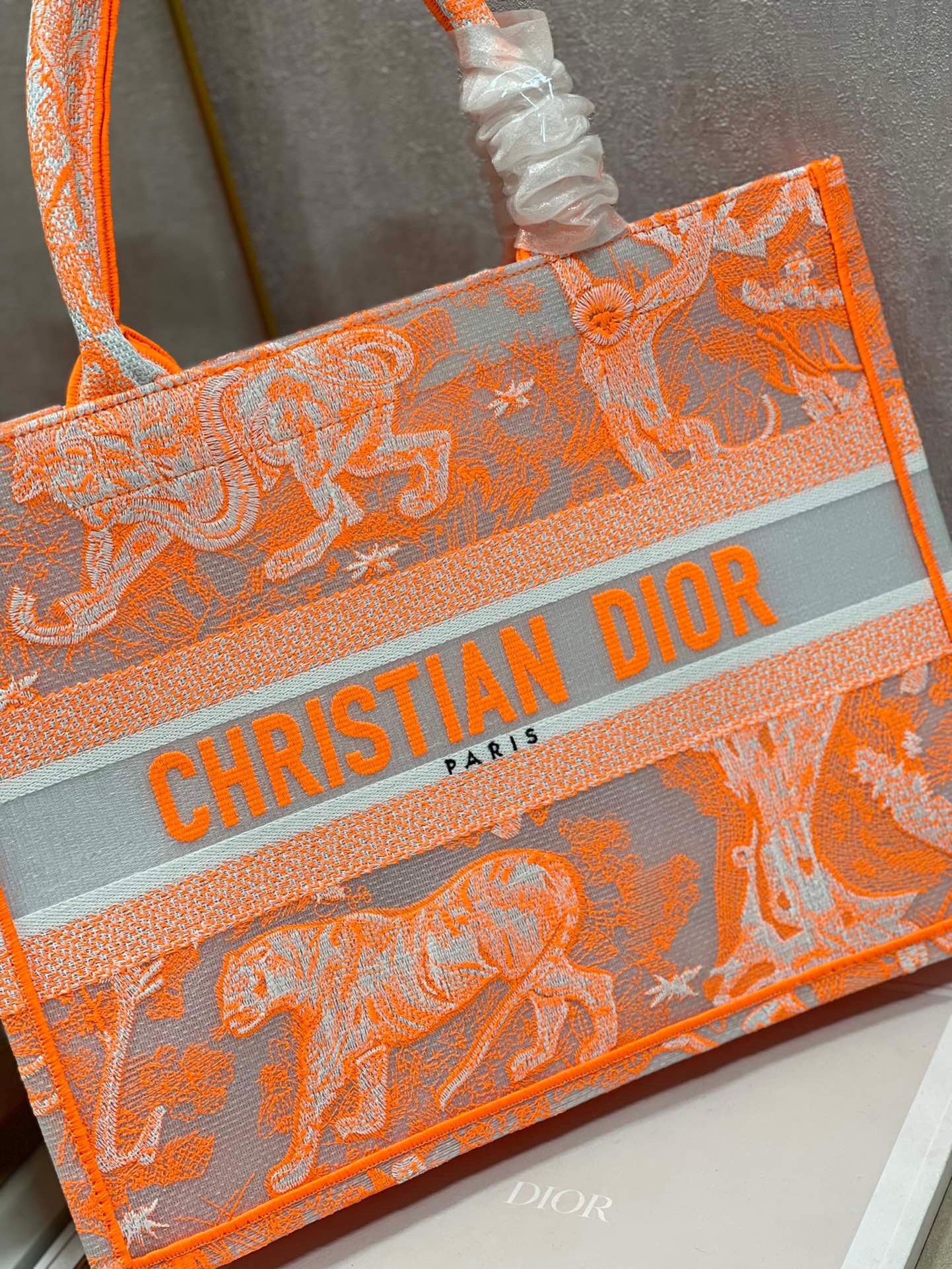 D*or medium book tote bag in orange transparent toile de jouy canvas