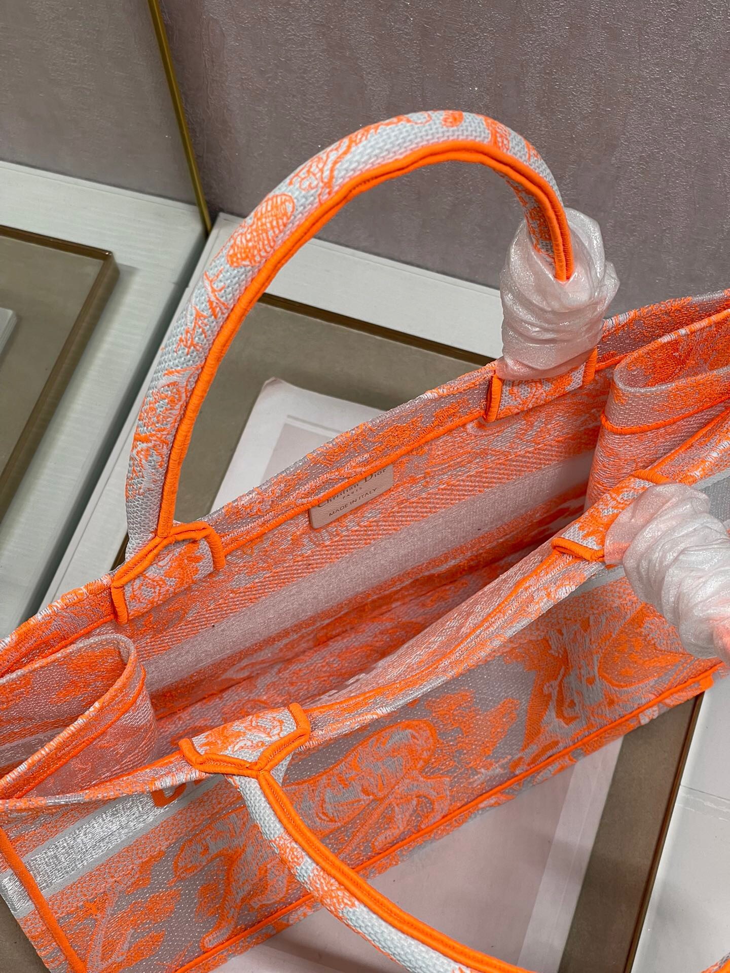 D*or medium book tote bag in orange transparent toile de jouy canvas