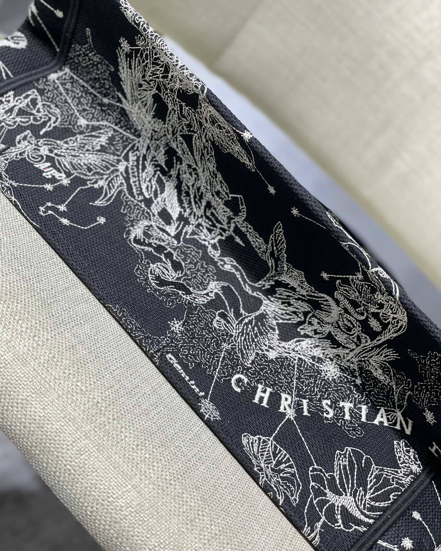 D*or medium book tote bag in black toile de jouy zodiac embroidery